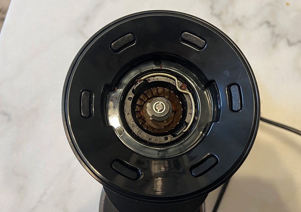 Closeup of a burr grinder system.