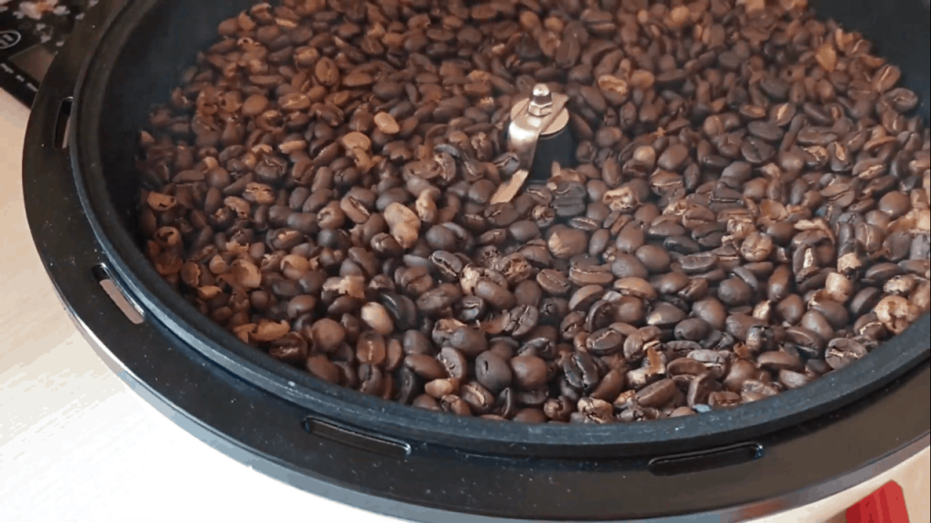 roasting coffee beans in a roaster