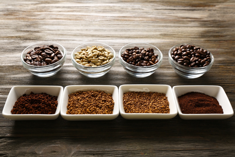 Coffee grinds in various sizes in bowls.